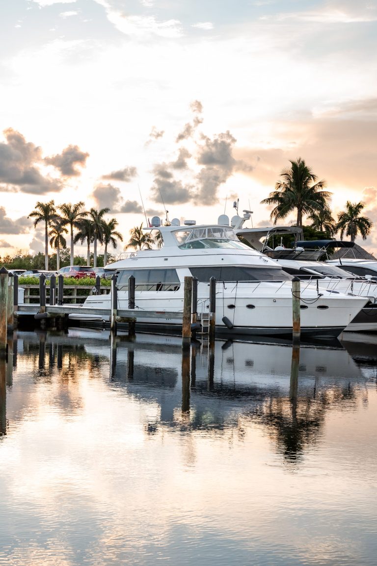 Yacht at Tarpon Point Marina during golden hour.
